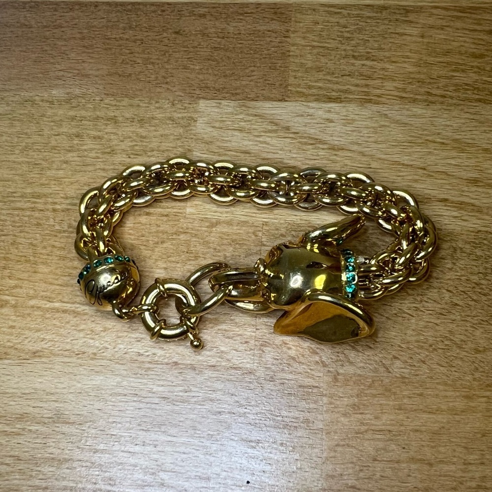 Guess gold tone elephant head bracelet with green rhinestone accents